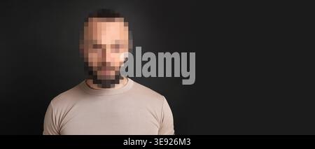 Anonymous man with pixelated face on dark grey background Stock Photo