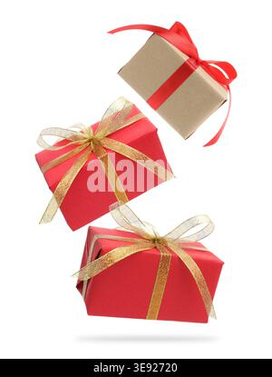 Gift boxes flying in air against white background Stock Photo