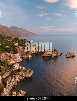 Aerial view of the historic Tonnara di Scopello with its red building ...
