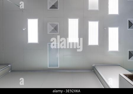 bottom-up view of the ceiling with industrial lighting and ventilation Stock Photo