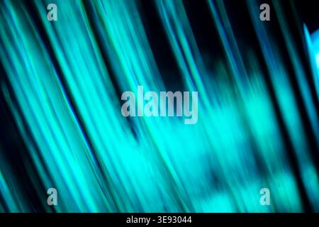 Abstract diagonal bright cyan glowing neon lines with speed motion blur Stock Photo
