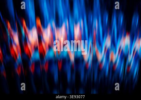 Abstract vibrant sound wave pattern with blue and red neon light trails reflecting on dark glass Stock Photo