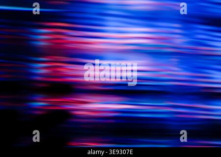 Horizontal fast motion blur pattern with intense blue and neon pink light reflections Stock Photo