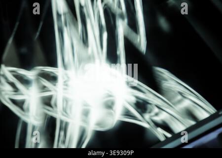 Abstract white light waves and swirling glowing motion blur on black Stock Photo