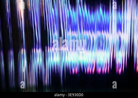 Vertical blurred glass texture with vibrant blue and pink neon light distortion Stock Photo