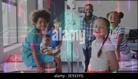 Smiling teacher in plaid shirt guiding five kids examining skeleton in classroom, circuit overlay Stock Photo