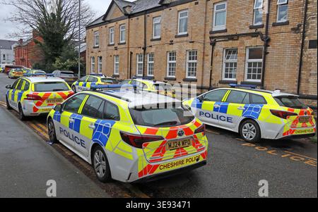 Multiple Cheshire Police cars assembled outside Warrington Police Station on Arpley Street in Warrington town centre. Stock Photo