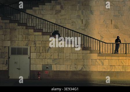 no caption needed for this conceptual photo of a partly lit staircase during night Stock Photo