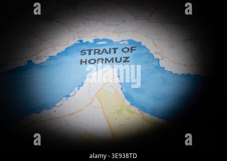 Conceptual map showing the Strait of Hormuz with a heavy dark vignette. Geopolitical tension, global shipping routes, oil supply concept. Stock Photo