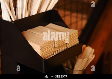Wooden sticks and paper napkins in cafe setting Stock Photo
