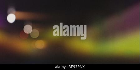 Abstract colorful blurry bokeh lights creating a vibrant pattern against a dark background, perfect for contemporary design Stock Photo