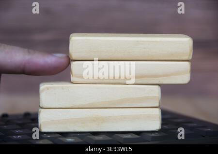 Hand pushing wooden blocks with customizable space for text or ideas. Copy space for commercial use Stock Photo