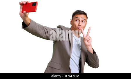 Man making funny face showing v sign taking selfie Stock Photo