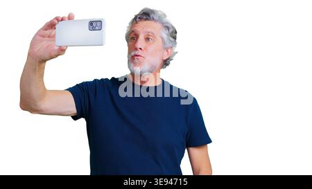 Mature man holding smartphone taking selfie with transparent background Stock Photo
