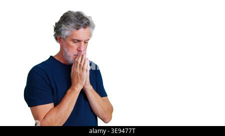 Mature man praying contemplating faith and hope on transparent background Stock Photo