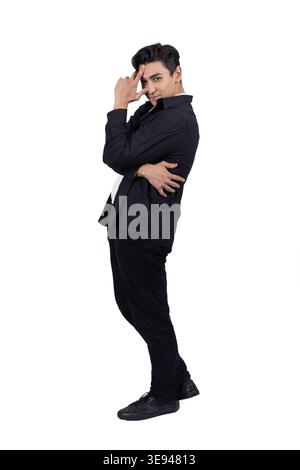 Confident man in black suit posing with hands on waist Stock Photo