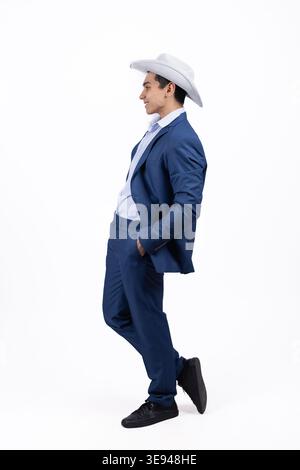 Stylish man in hat and suit posing on white background Stock Photo