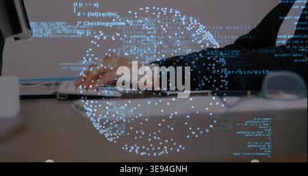 Typing woman in dark blazer working on laptop at desk, with left monitor, holographic code globe Stock Photo