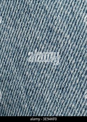 Denim texture closeup showing detailed weave pattern, ideal for background or fashion concepts. Mobile photo Stock Photo