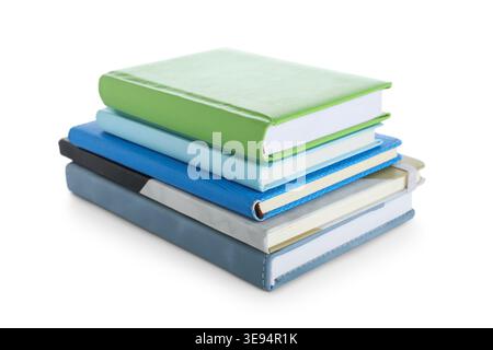 Stack of many different notebooks isolated on white background Stock Photo