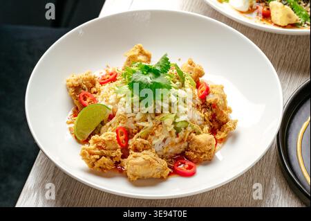 Asian fried rice with chicken and vegetables Stock Photo