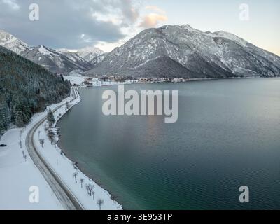 snow covered mountain lake achensee in austria with pertisau winter landscape Stock Photo