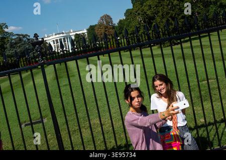 Two women take a selfie in front of the White House. Stock Photo