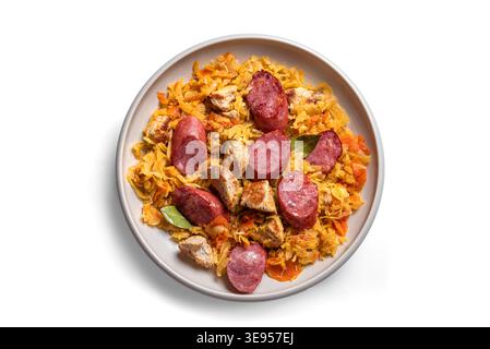 Traditional Polish Bigos meal or Hunter's stew with sausages, meat and stewed cabbage isolated on white background, top view, design element. Homemade Stock Photo