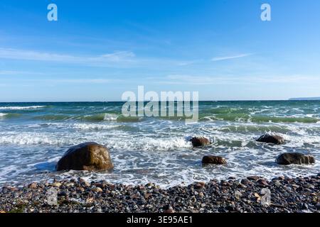 sea waves on the beach with rocks baltic sea ruegen island Stock Photo