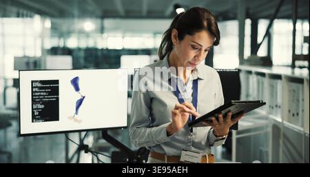 Prosthetics, reading or woman with tablet in office, biomedical engineering or artificial leg development. Planning, tech or mature robotics expert Stock Photo