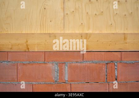 red brick wall half with wooden texture Stock Photo