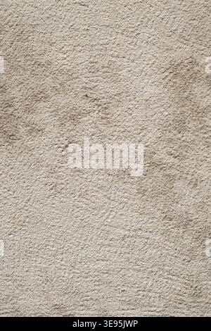 Neutral sandstone wall texture with soft grain and clean natural surface background. Stock Photo