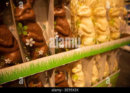Chocolate bunnies in foil are widely available on the supermarket shelves. Stock Photo