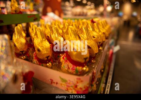 Chocolate bunnies in foil are widely available on the supermarket shelves. Stock Photo