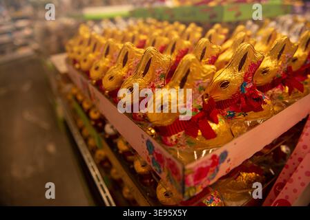 Chocolate bunnies in foil are widely available on the supermarket shelves. Stock Photo