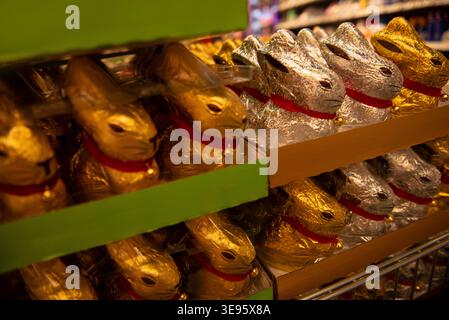 Chocolate bunnies in foil are widely available on the supermarket shelves. Stock Photo