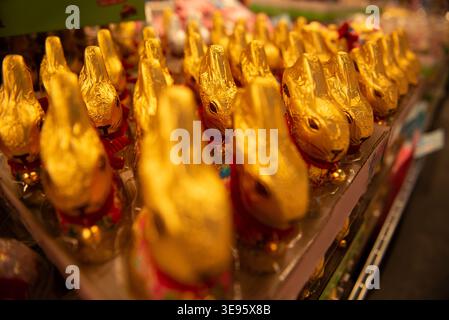 Chocolate bunnies in foil are widely available on the supermarket shelves. Stock Photo