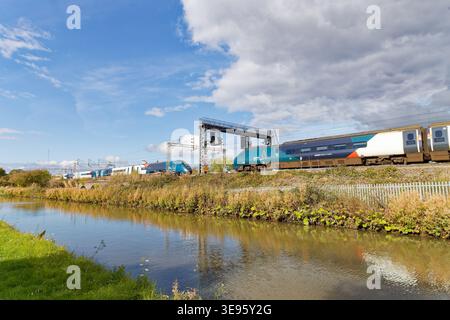 Avanti West Coast Evero/Pendolino trains services pass at Ansty/Shilton alongside the Oxford canal, Stock Photo
