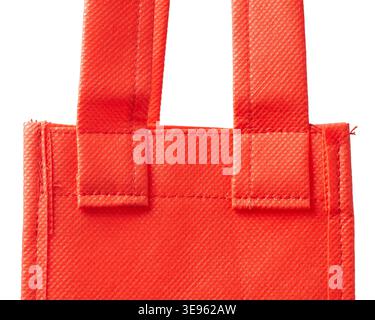 closeup of handle attachment points on red fabric shopping bag isolated white background, reinforced stitching and cross hatched texture, mockup Stock Photo