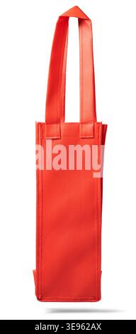 empty tall red fabric shopping bag isolated white background, textured synthetic material with matching handles, side view mockup template with shadow Stock Photo