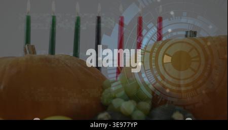 Displaying two orange pumpkins and gourds on table, with bead garland, lit candles and HUD overlay Stock Photo