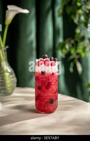 Berry cocktail with ice and fresh mixed berries Stock Photo