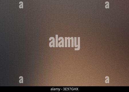 Abstract bronze gradient background showing textured surface with warm tones Stock Photo