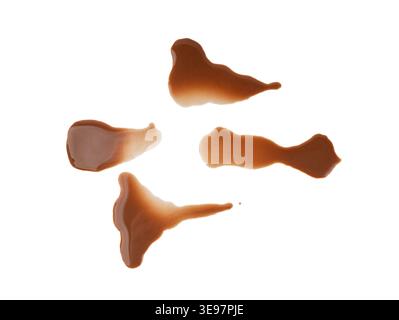 Spilled chocolate milk isolated, hot chocolate puddle, liquid stain, coffee splatter, brown latte with on white background Stock Photo