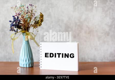 Editing the word written on the notepad and on the desktop Stock Photo