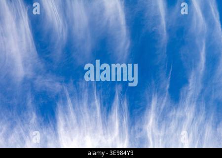 High altitude cirrus cloud formations with wispy feather streaks sky Stock Photo