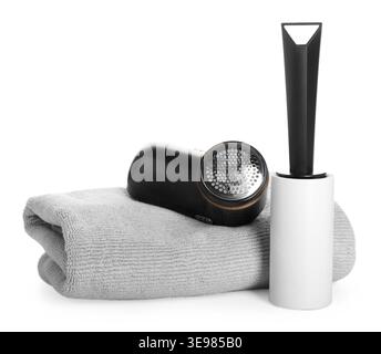 Lint roller, fabric shaver and sweater isolated on white Stock Photo
