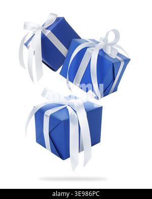 Gift boxes flying in air against white background Stock Photo