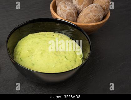 Red mojo rojo and green mojo verde sauces, traditional Tenerife dips, mojo picon dressing, Canary Islands Papas arrugadas sea water boiled potatoes, S Stock Photo