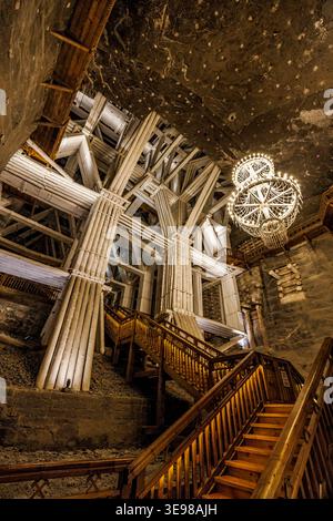 Crystal salt chandelier hanging over stairs in the Wieliczka salt mine, Poland Stock Photo